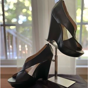 NINE WEST, black wedge stacked front zipper on heel.